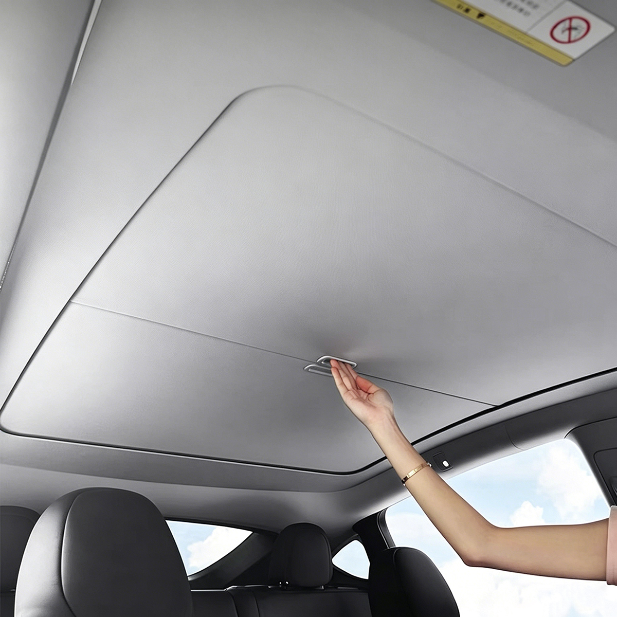 Hand sliding to close the Aegiswarn AW-MS2-TMY manual retractable sunshade for Tesla Model Y